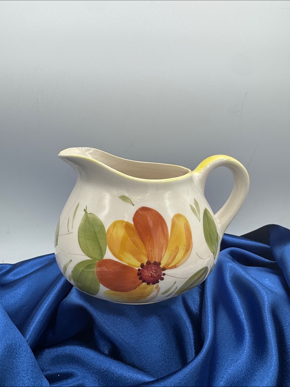 Secla pottery pitcher hand-painted in Portugal featuring a fun floral design